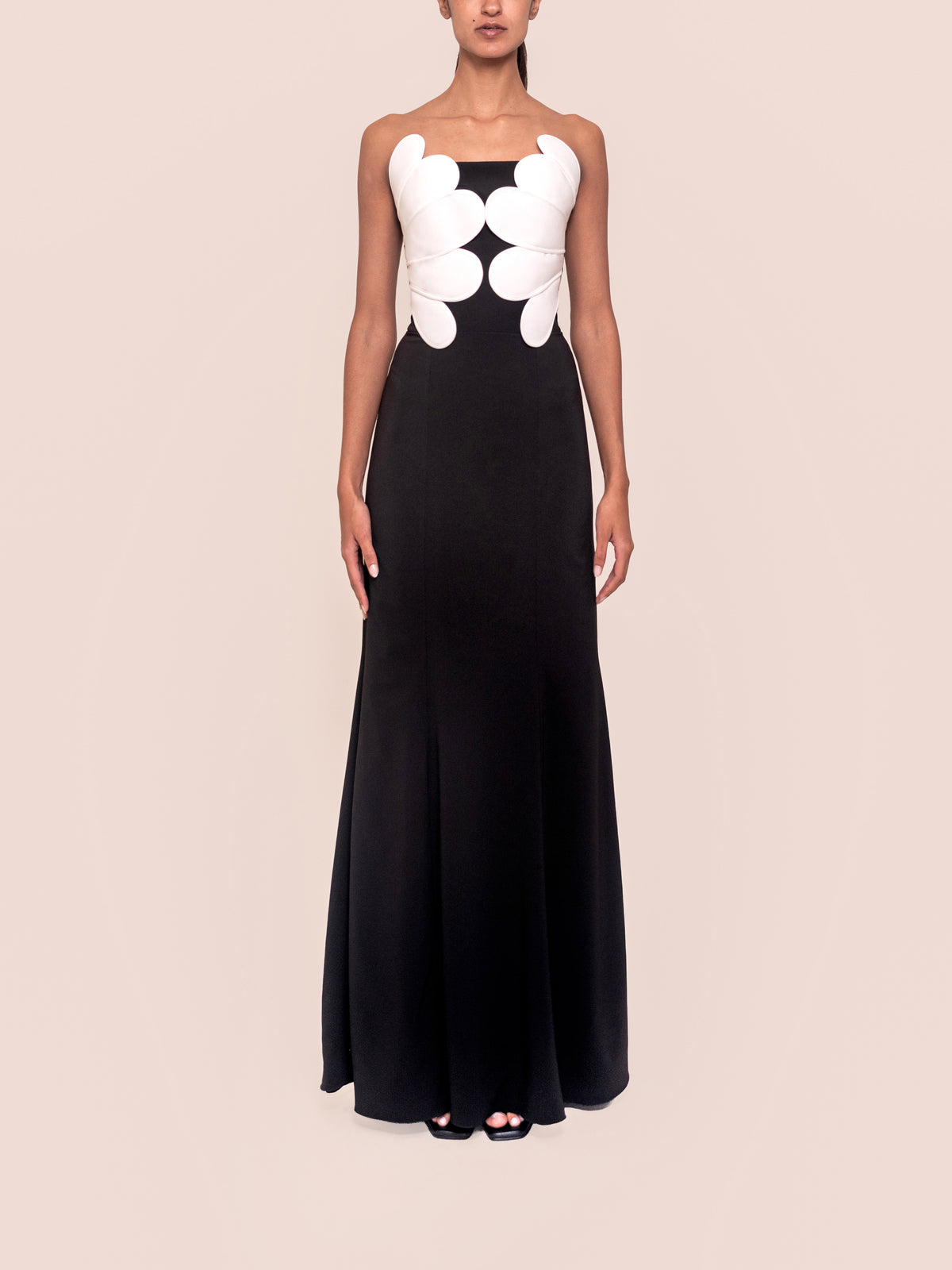 Black maxi dress with white flower applique at bodice, sleeveless sweetheart shape