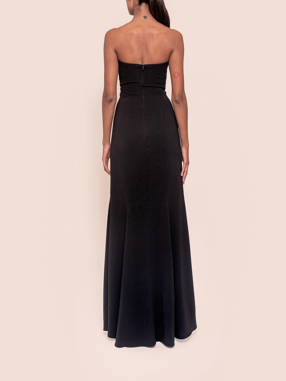 Black maxi dress back view with thin straps and fitted waist