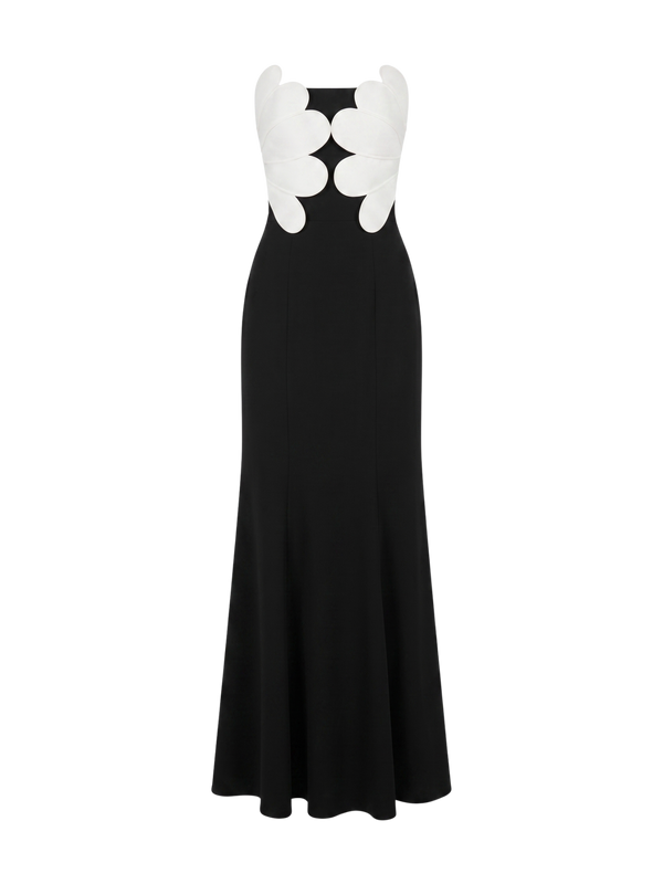 Black maxi dress with white flower applique at the bust, fitted bodice